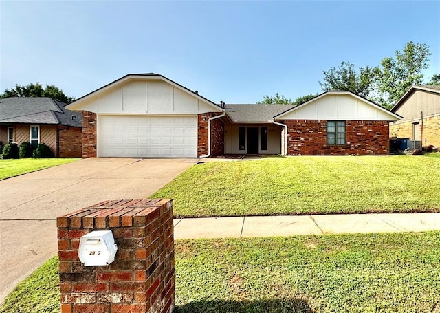 2900 Pheasant Run, Edmond, OK 73012 - single story home with a garage, driveway, a front lawn, board and batten siding, and brick siding