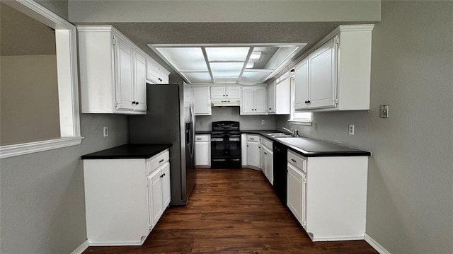 2900 Pheasant Run, Edmond, OK 73012 - kitchen with black appliances, dark countertops, a sink, dark wood-style floors, and a textured wall