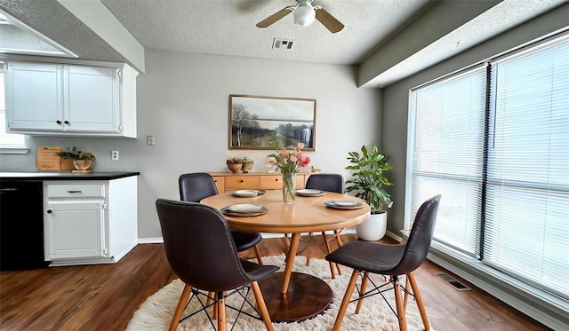 2900 Pheasant Run, Edmond, OK 73012 - dining area with dark wood-type flooring, a ceiling fan, a textured ceiling, and baseboards
