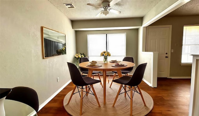 2900 Pheasant Run, Edmond, OK 73012 - dining space with a textured ceiling, wood finished floors, ceiling fan, baseboards, and a textured wall