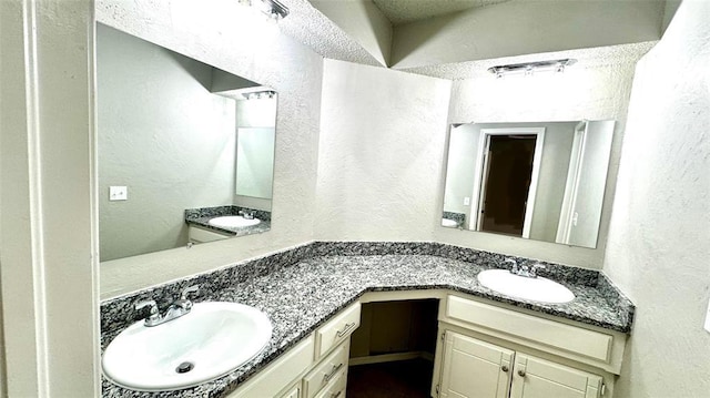 2900 Pheasant Run, Edmond, OK 73012 - bathroom with double vanity and a textured wall