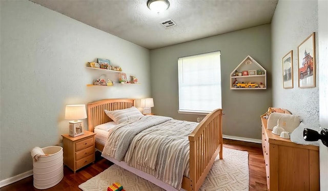 2900 Pheasant Run, Edmond, OK 73012 - bedroom featuring wood finished floors and baseboards