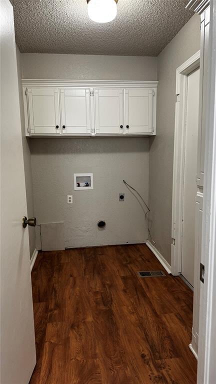 2900 Pheasant Run, Edmond, OK 73012 - laundry area with electric dryer hookup, cabinet space, washer hookup, dark wood-style floors, and baseboards