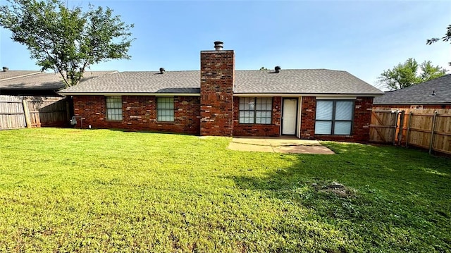 2900 Pheasant Run, Edmond, OK 73012 - rear view of house featuring a patio area, a chimney, brick siding, and roof with shingles
