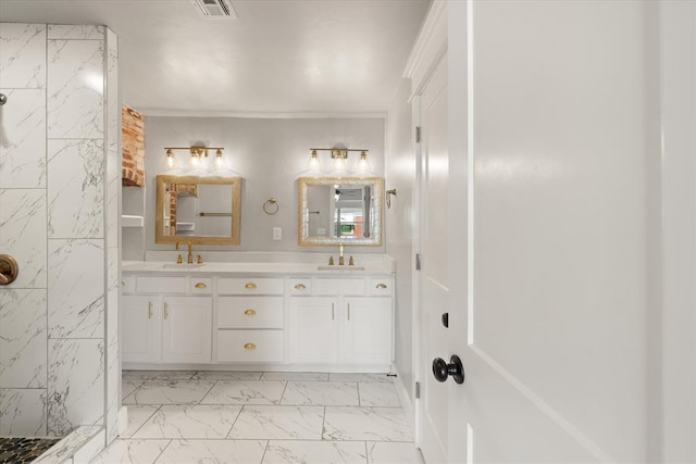 bathroom with a tile shower, double vanity, marble finish floor, a sink, and visible vents