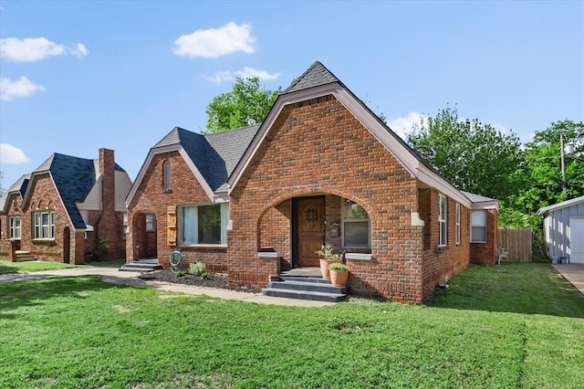 2541 NW 12th St, Oklahoma City, OK 73107 - english style home with brick siding and a garage
