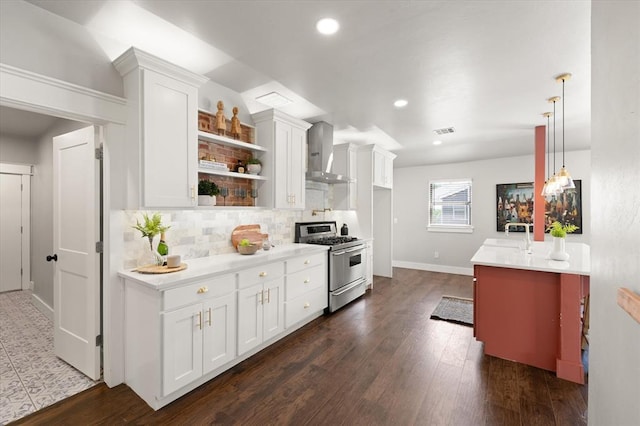 2541 NW 12th St, Oklahoma City, OK 73107 - kitchen featuring high end stainless steel range oven, wall chimney exhaust hood, tasteful backsplash, light countertops, and recessed lighting