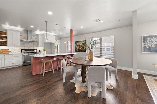 2541 NW 12th St, Oklahoma City, OK 73107 - dining room with baseboards, recessed lighting, and dark wood-type flooring
