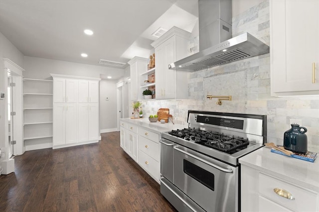 2541 NW 12th St, Oklahoma City, OK 73107 - kitchen with range with two ovens, open shelves, wall chimney exhaust hood, white cabinetry, and decorative backsplash