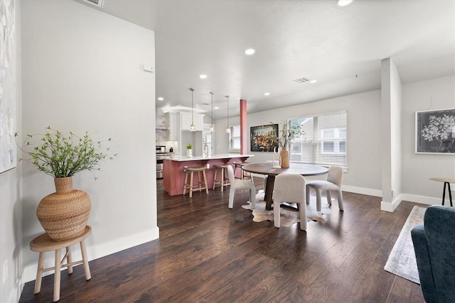2541 NW 12th St, Oklahoma City, OK 73107 - dining room with recessed lighting, dark wood-style flooring, and baseboards