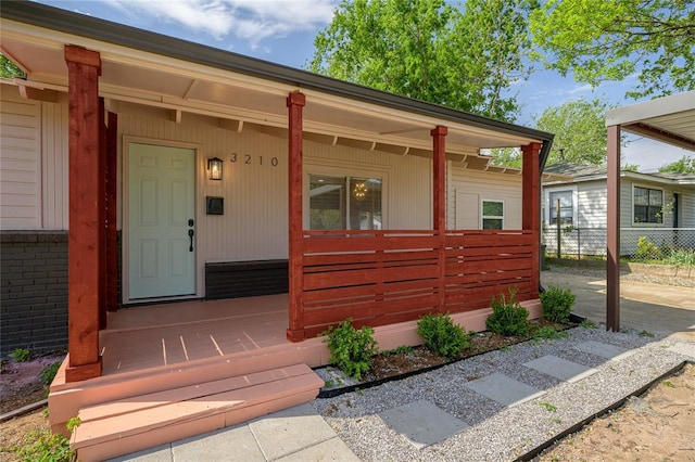 3210 SE 16th St, Oklahoma City, OK 73115 - doorway to property featuring covered porch