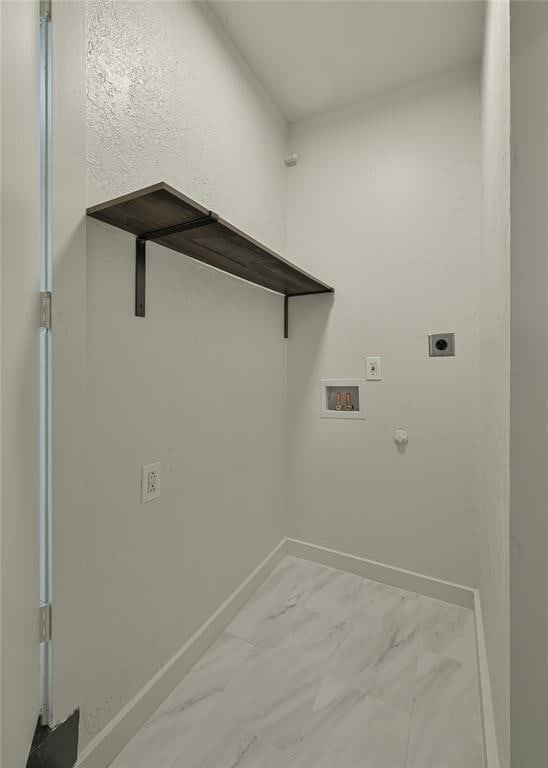 3210 SE 16th St, Oklahoma City, OK 73115 - washroom with hookup for an electric dryer, baseboards, washer hookup, light marble finish floors, and hookup for a gas dryer