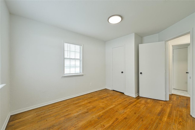 3210 SE 16th St, Oklahoma City, OK 73115 - unfurnished bedroom with wood finished floors, baseboards, and a closet