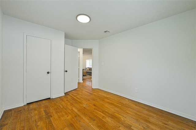 3210 SE 16th St, Oklahoma City, OK 73115 - unfurnished bedroom featuring wood finished floors and baseboards