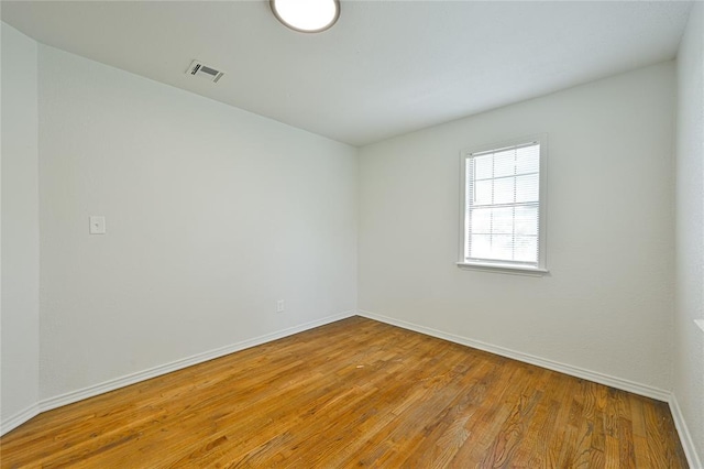 3210 SE 16th St, Oklahoma City, OK 73115 - spare room with wood finished floors and baseboards