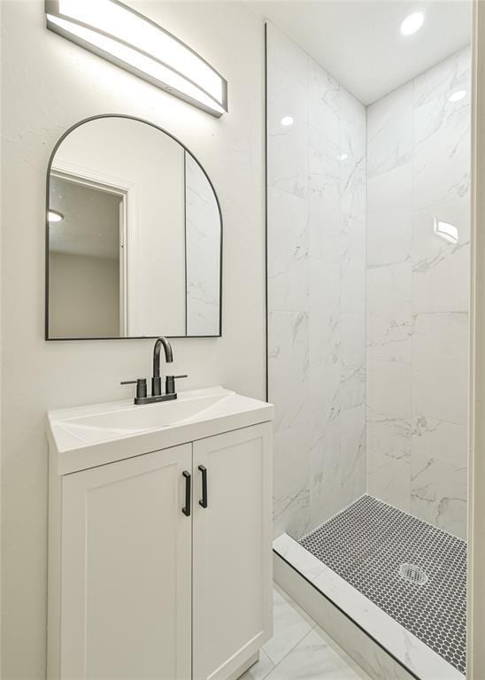3210 SE 16th St, Oklahoma City, OK 73115 - bathroom featuring marble look tiles, a stall shower, vanity, and recessed lighting