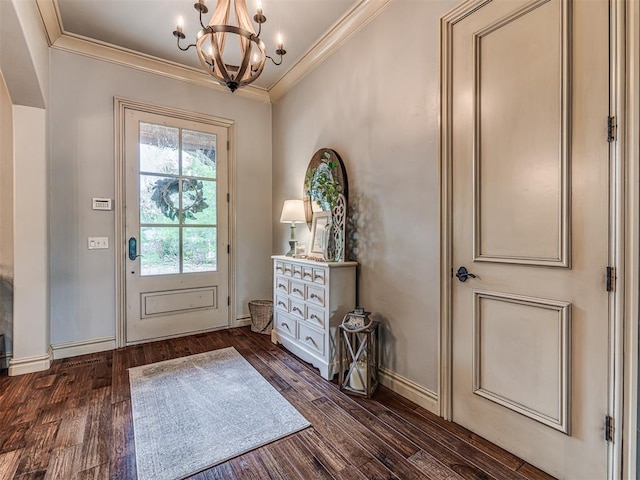 entryway featuring an inviting chandelier, baseboards, ornamental molding, and wood finished floors