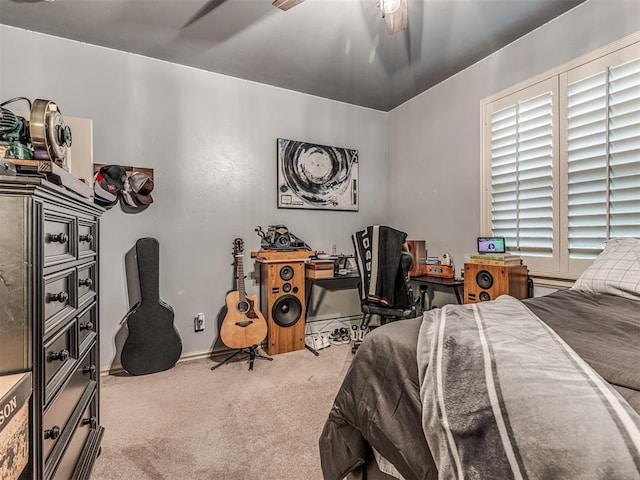 carpeted bedroom with baseboards and ceiling fan