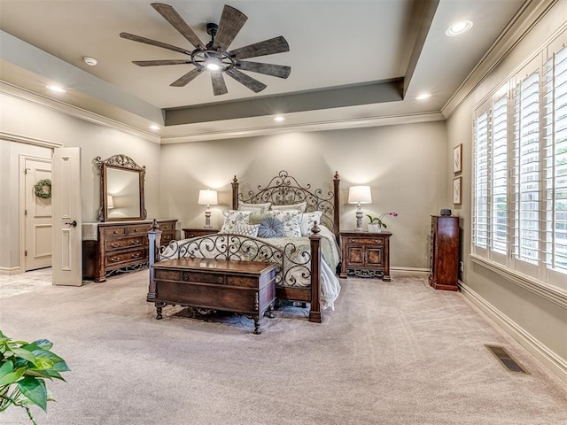 bedroom featuring crown molding, carpet floors, recessed lighting, baseboards, and a tray ceiling