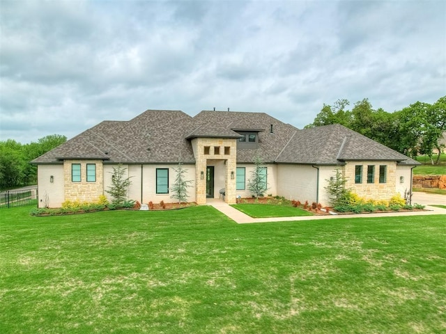 9401 Autumn Park Ln, Oklahoma City, OK 73151 - view of front facade featuring a front lawn, roof with shingles, fence, and stone siding