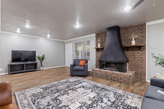 1312 N Nail Pkwy, Moore, OK 73160 - living room featuring wood finished floors, a textured ceiling, baseboards, ornamental molding, and recessed lighting