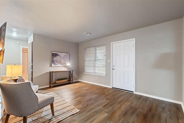 1312 N Nail Pkwy, Moore, OK 73160 - living area featuring wood finished floors and baseboards