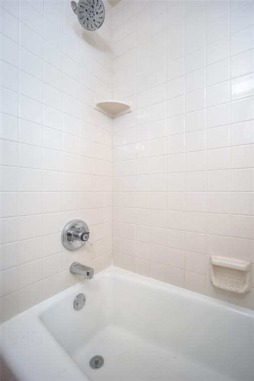 bathroom featuring  shower combination