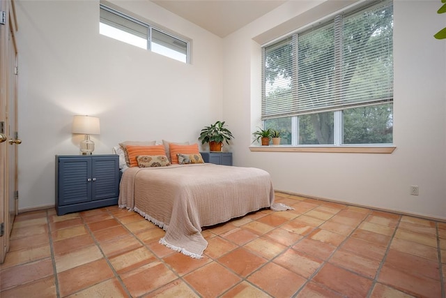 bedroom with multiple windows