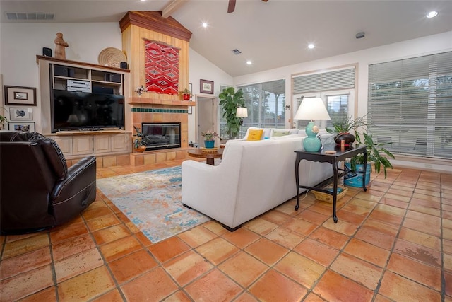 living room with visible vents, recessed lighting, beam ceiling, and a fireplace