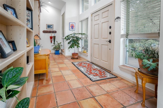foyer featuring baseboards