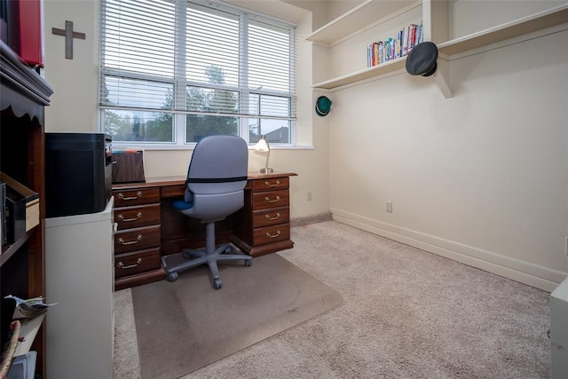 home office with carpet floors and baseboards