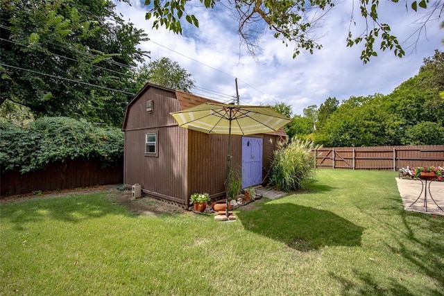 view of outdoor structure with an outbuilding and a fenced backyard