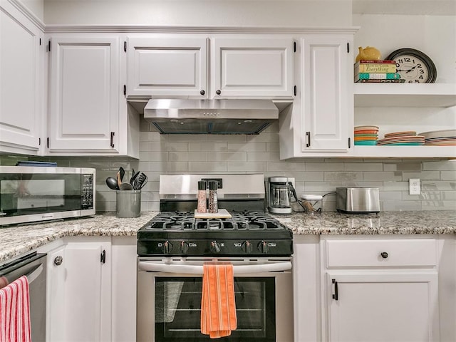 kitchen featuring backsplash, white cabinetry, appliances with stainless steel finishes, and under cabinet range hood