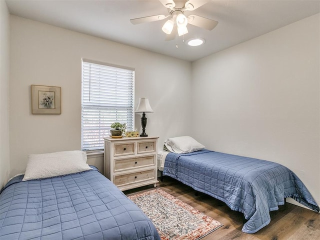bedroom featuring ceiling fan and wood finished floors