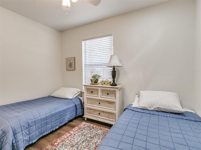 bedroom with ceiling fan and wood finished floors