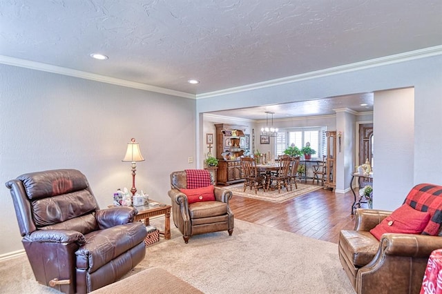 living room with recessed lighting, a chandelier, ornamental molding, and wood finished floors