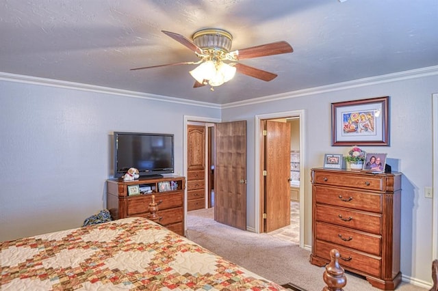 carpeted bedroom with crown molding, ceiling fan, and connected bathroom