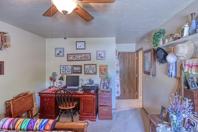 home office with carpet flooring and ceiling fan