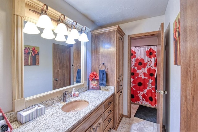 bathroom with tile patterned floors and vanity
