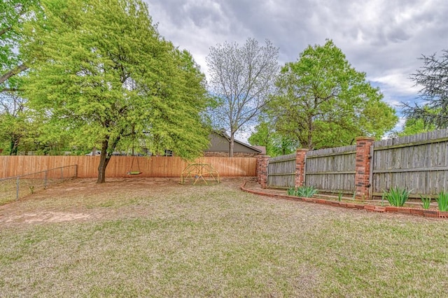 view of yard with a fenced backyard