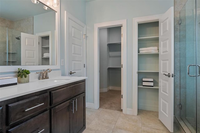 full bath featuring a walk in closet and a stall shower