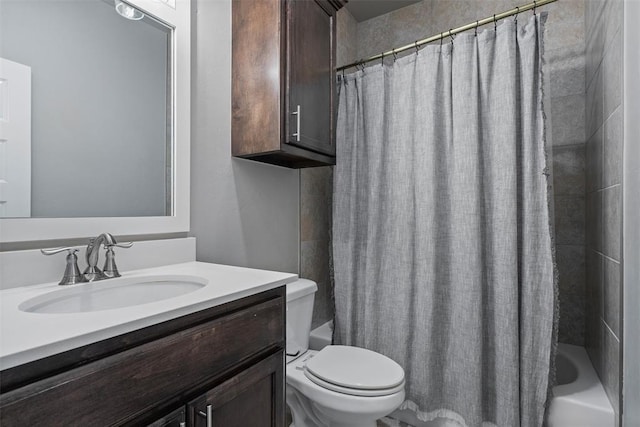 bathroom with toilet, vanity, and shower / bath combination with curtain
