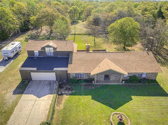 drone / aerial view with a view of trees