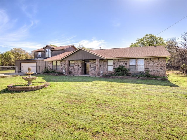 view of front of property with fence, brick siding, a front yard, and a garage