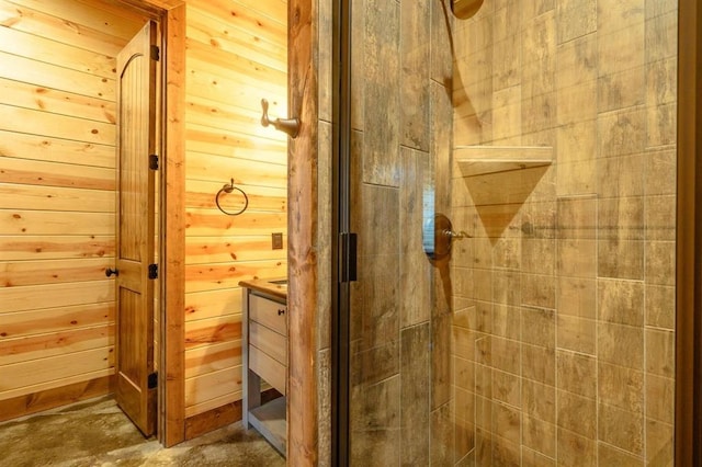 312 Sugar Pine Loop, Broken Bow, OK 74728 - full bathroom featuring wooden walls, a stall shower, and concrete floors