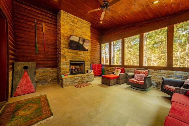 312 Sugar Pine Loop, Broken Bow, OK 74728 - carpeted living room with wood ceiling, wood walls, recessed lighting, a ceiling fan, and an outdoor stone fireplace