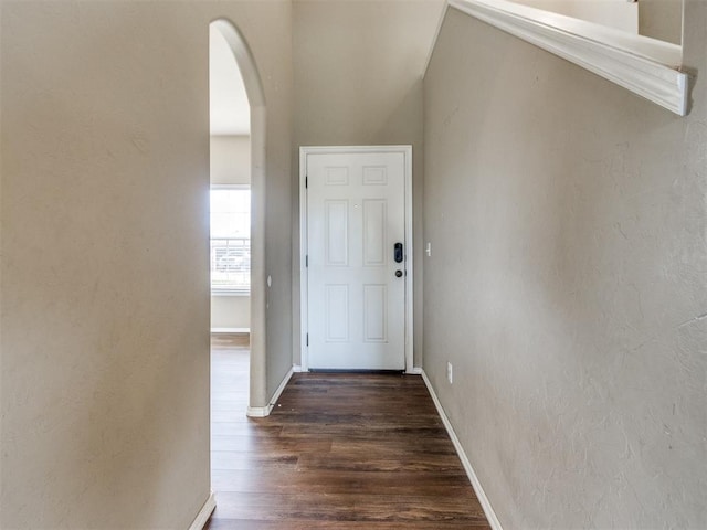 13309 Beaumont Dr, Piedmont, OK 73078 - entryway featuring baseboards, arched walkways, a textured wall, and wood finished floors