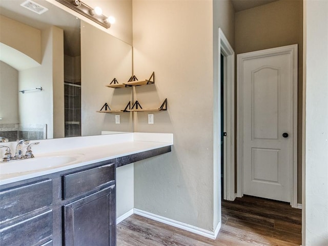 13309 Beaumont Dr, Piedmont, OK 73078 - bathroom featuring baseboards, visible vents, wood finished floors, and vanity