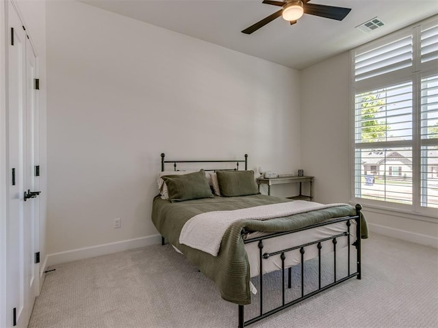 8241 Red Feather, Arcadia, OK 73007 - bedroom with light colored carpet, a ceiling fan, baseboards, and visible vents