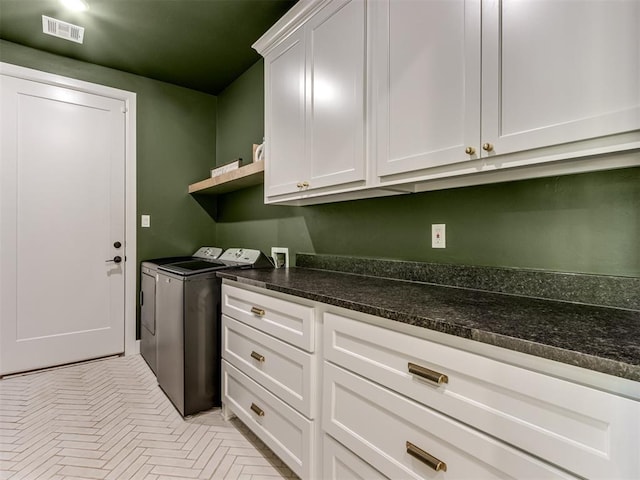 8241 Red Feather, Arcadia, OK 73007 - washroom featuring cabinet space, visible vents, and washing machine and dryer